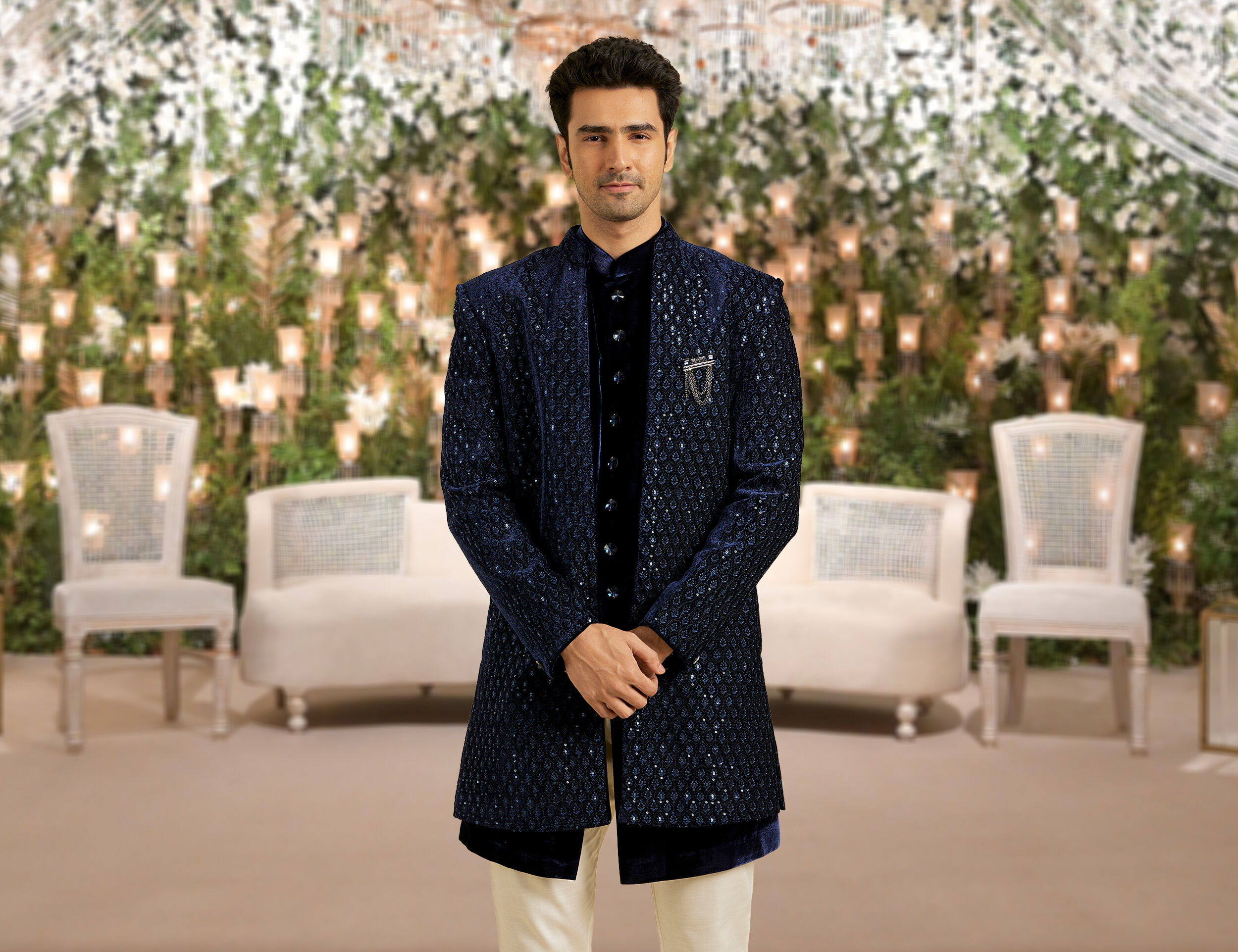 A groom in blue colour indo western sherwani for his wedding